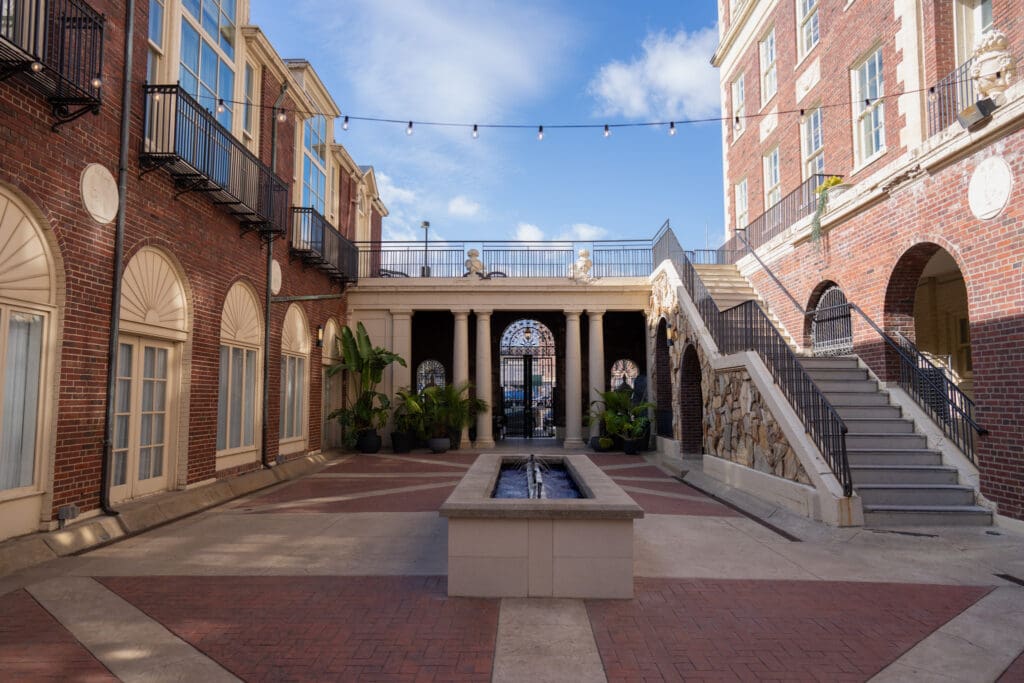 elegant Magnolia hotel courtyard wedding venue in Nebraska with romantic architecture and outdoor reception space